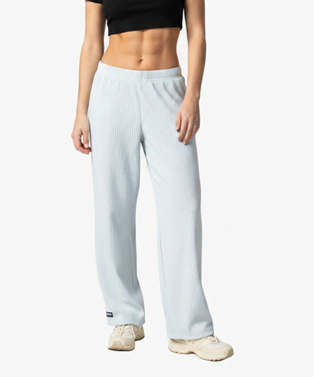Person wearing Loones Aura trousers on a white background