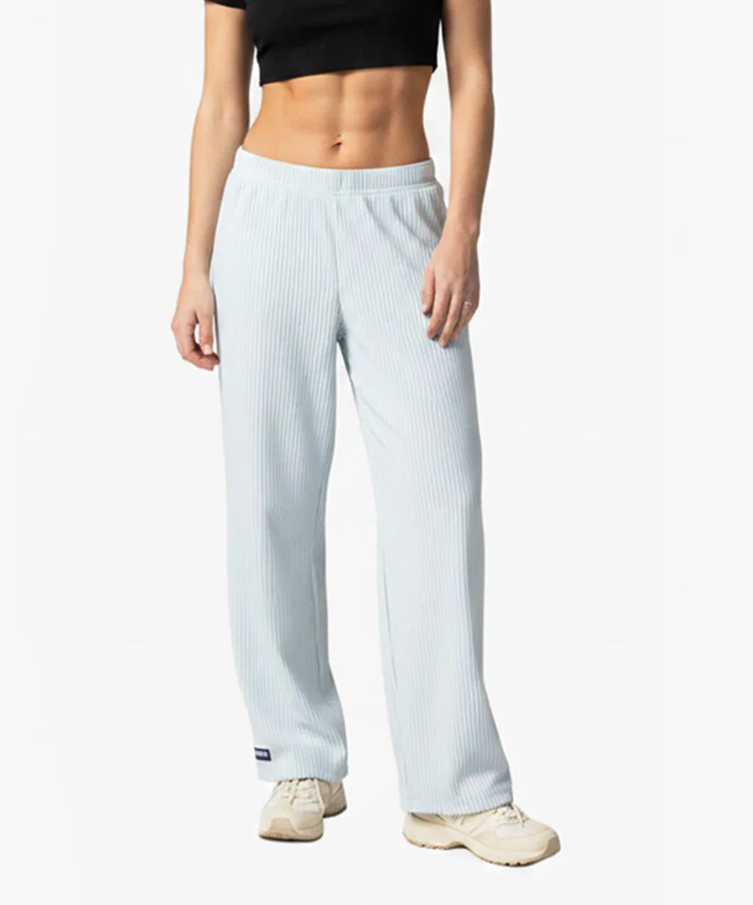 Person wearing Loones Aura trousers on a white background