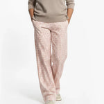 Person wearing Loones coppafeel! trousers on a white background