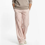 Person wearing Loones coppafeel! trousers on a white background