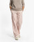 Person wearing Loones coppafeel! trousers on a white background