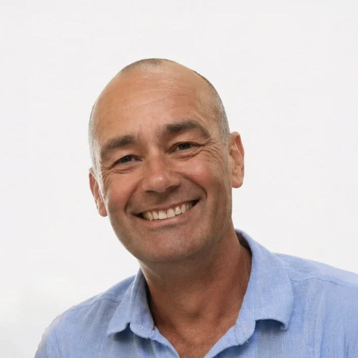 Man wearing a light blue shirt against a white background
