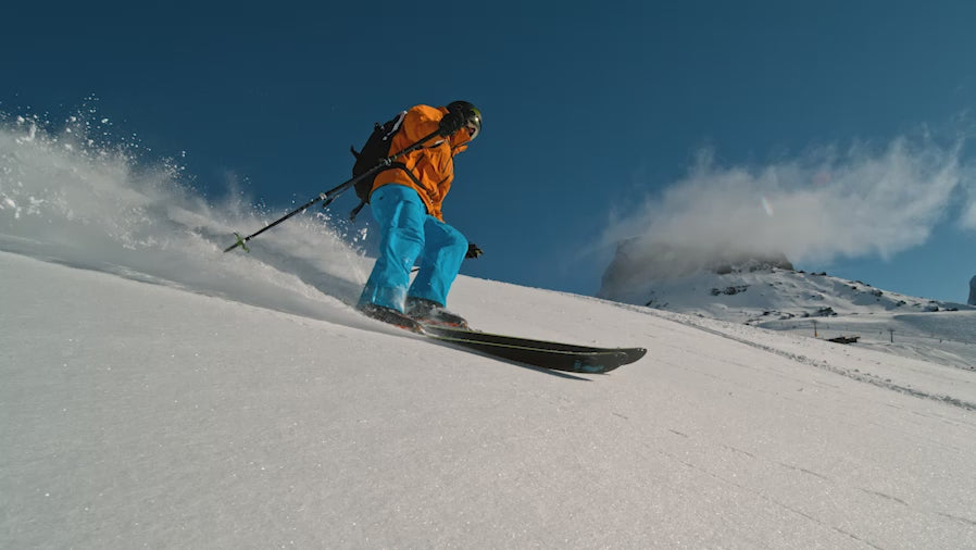 Video showing a skier skiing in the mountains.