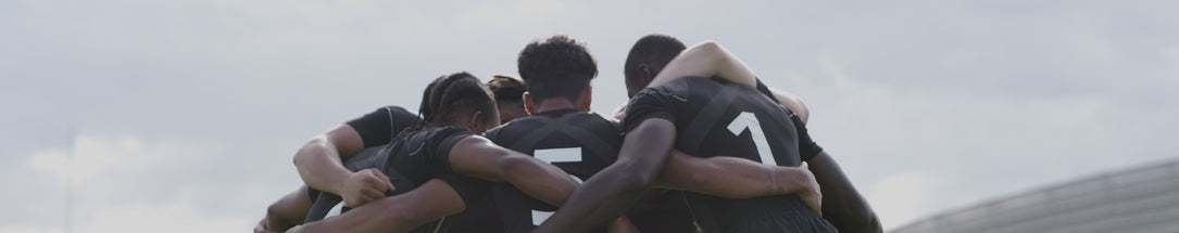 Video of a group of rugby players huddling together for a team talk